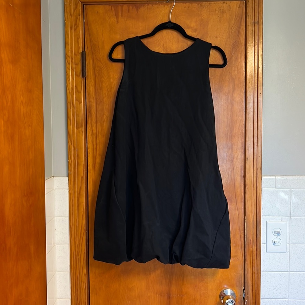 COS black dress size small with fun skirt bottom. Good condition